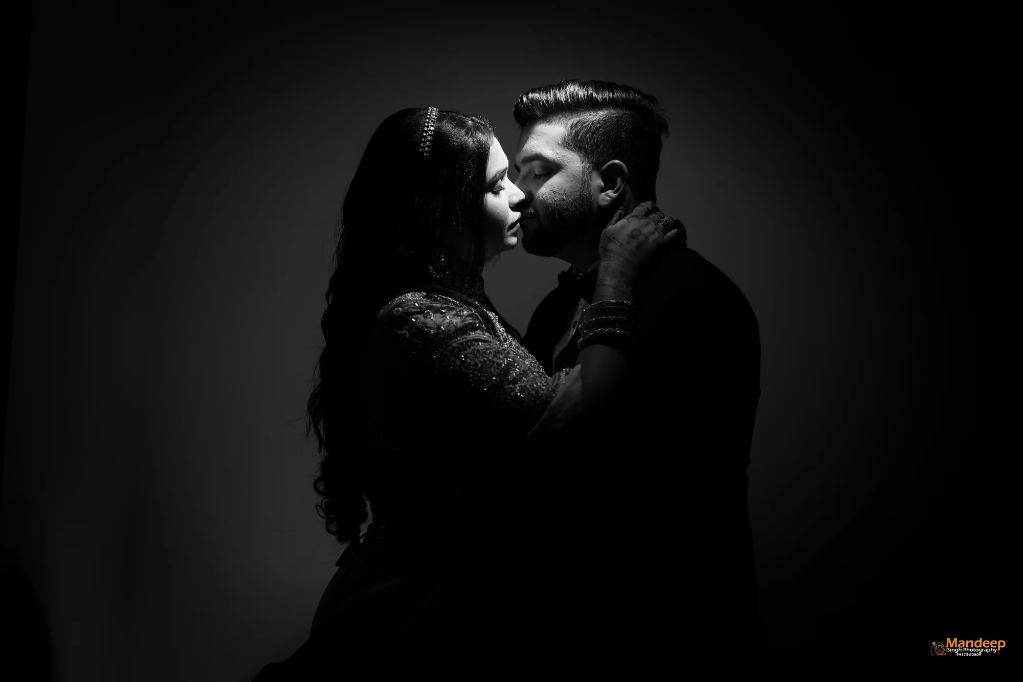 Tanya and Vyom in a dramatic black and white portrait